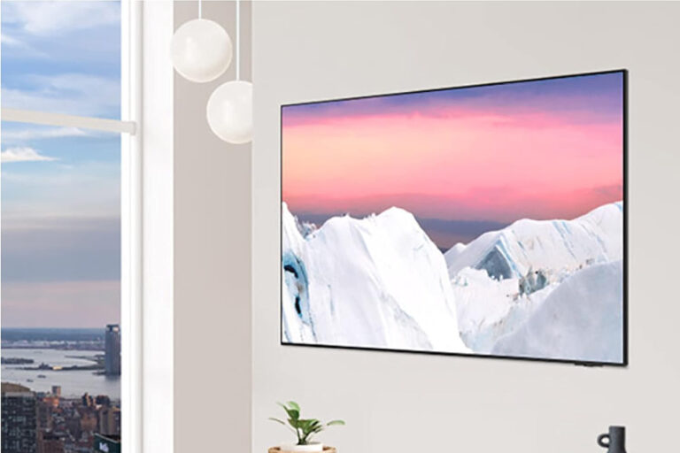 Product shot of the Samsung S90C OLED TV mounted on a wall.