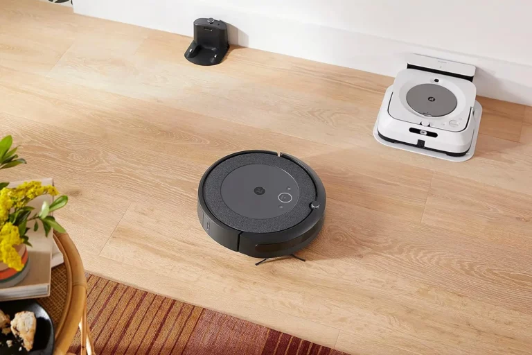 A lifestyle image of the iRobot Roomba i4 EVO Robot Vacuum cleaning a hardwood floor