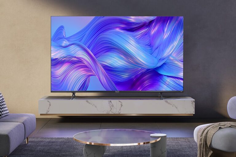 A large flat-screen 4K smart TV in a living room.